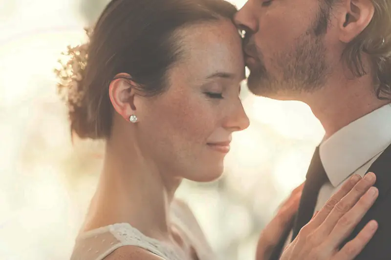 Bride and groom embracing